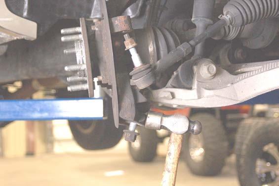 . Place jack stands under the frame rails and lower onto jack stands. 3.