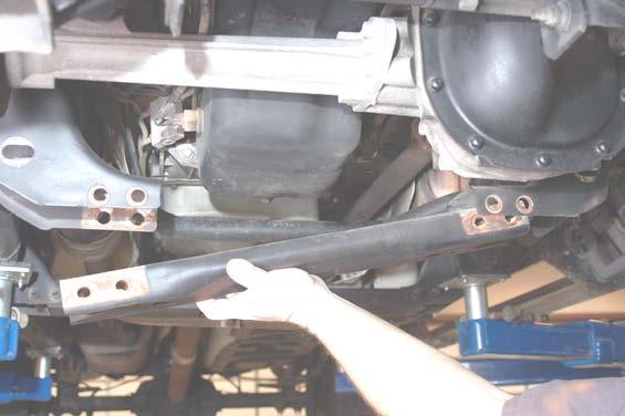 wrench as shown in Photo 8 and remove the strut from the vehicle. PHOTO 7 PHOTO 8.
