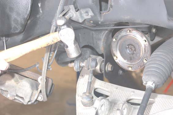 It may be necessary to use a hammer as shown in Photo 0 to separate the sway bar link