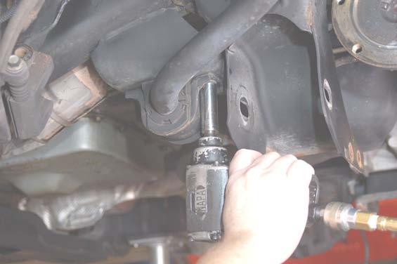 Remove the drive shaft bolts using a mm point socket.