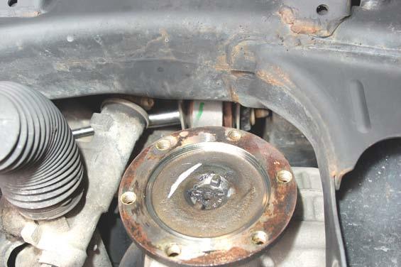 Remove the upper differential bolt as shown in Photo using a 5mm socket.