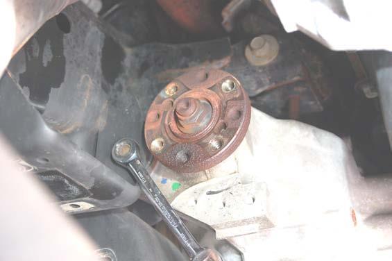 Loosen the rear driver side bolt and the passenger side bolt on the differential
