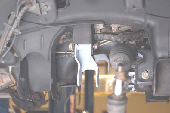 Install driver side differential bracket with factory hardware as shown in Photo 3
