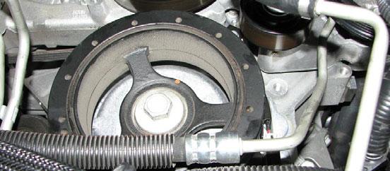 Install the supplied GM crank bolt into the crank and torque it to 37 ft-lbs, then rotate it an additional 140. 90. Slide the steering rack back into place and reconnect the electrical connector. 85.