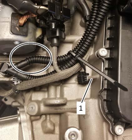 Tighten the cable just so the hose will not come into contact with the starter <circle>. NOTE Engine shown removed for clarity.