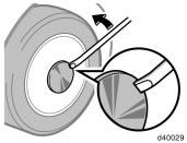 Always loosen the wheel nuts before raising the vehicle. Turn the wheel nuts counterclockwise to loosen.