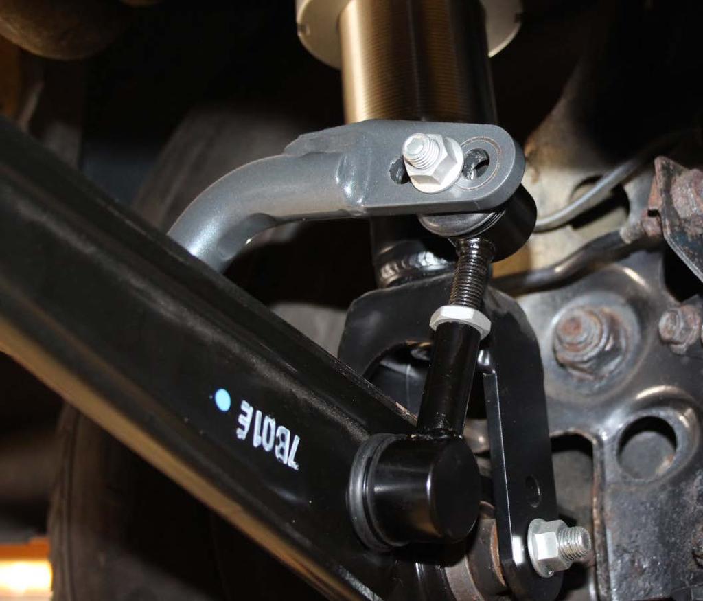 Attach the end link into the OEM location on the control arm and secure with the flange nut. Torque to 38-42 ft/lbs.