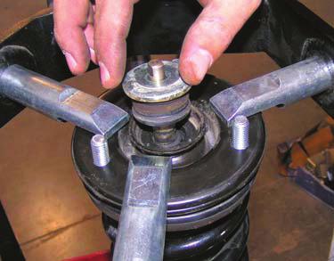 g. Align marks on coil spring, upper plate, and shock.