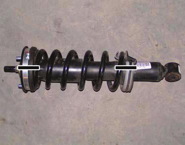 Install coil-over assembly onto lower control arm with nut and bolt. Coil-Over Assy. Nut Bolt & Nut h.