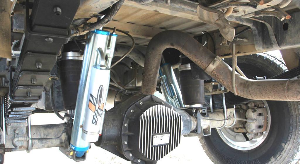 Follow Instructions in U-Bolt Box to install the Rear Leaf Springs. REAR SHOCKS 42. Remove Spare Tire 43. Mount the rear shocks using the factory hardware. 44.