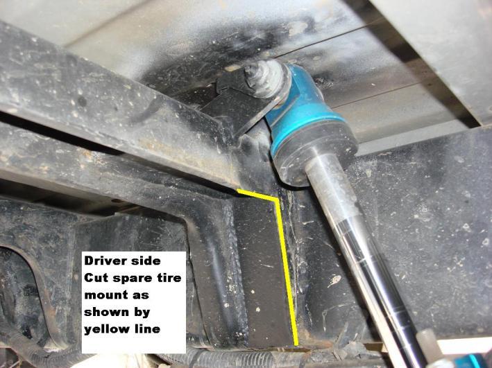 Cut the front of the shock-mount crossmember at the driver side (flush with the frame, and square it up to the straight portion of the crossmember). 46.