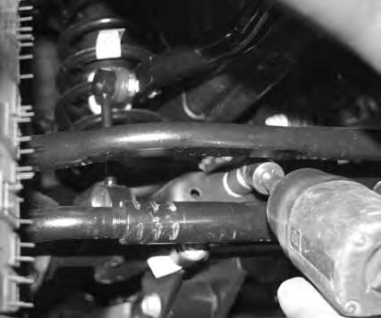 Place bump stop in coil spring, and install coil spring.