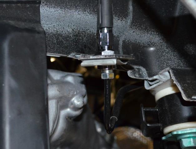 n) Install the brake line in the factory holder attached to the strut. The top portion of the holder unscrews. This can be tightened in place with a wrench but do not over tighten.