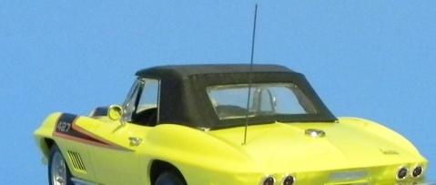 If you are using the convertible top [#62 satin black] attach the rear window and set it in place [should not be glued, but can be if desired].