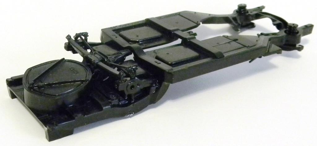 I emailed Revell about this and they are aware. Saying it has been fixed on the next run of kits]. Now take the chassis [#60 Gloss Black] and add the cross member [#43 Gloss Black].