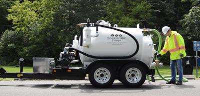 Super Duty TVP 450 Series Vacuum Pumps TVP-450, 450 gallon model shown with DOT compliant trailer and optional storage bin. Rear view. Optional manway shown.