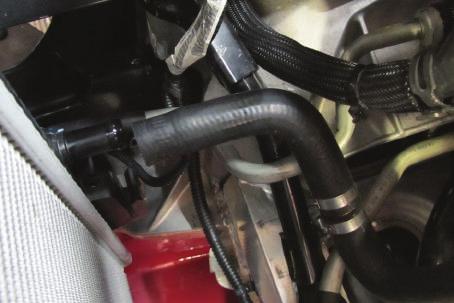 Secure to the OEM plastic tee using the OEM spring clamp. (See Fig. 3-f) Fig. 3-f: Re-attach Supplemental Radiator Hose G.