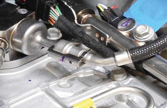 Install the provided fuel line in the same place as the OEM fuel line.