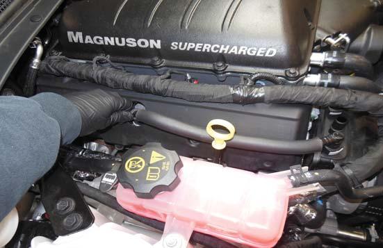 to the left side valve cover where shown with an
