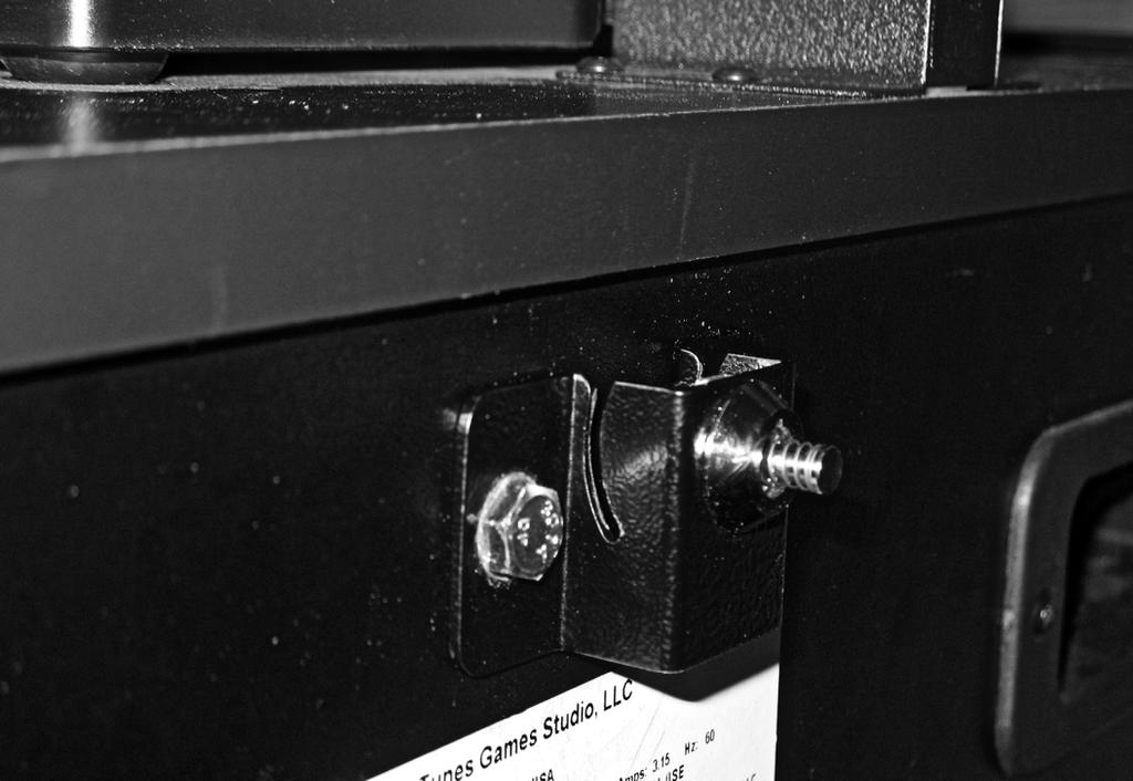 Place the flange nuts on the inside of the rear cabinet wall and secure the bracket to the cabinet with the machine screws. 8. Replace and lock the rear door of the Kiosk.