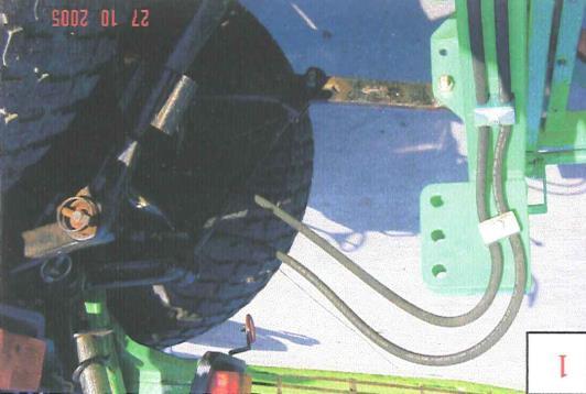 Fit the tractor lower link arms to the lower linkage pins with the tractor