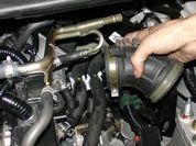 Remove the battery from the engine compartment and set it on a