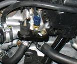 Place finger over the port to prevent coolant from