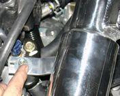 1/2 straight hose located on the throttle body.
