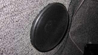 1524. The front speaker cover installed, as shown. 1525.