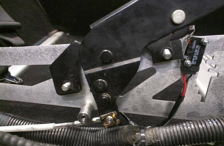 Place handbrake mounting plate into the car and slide the handbrake mechanism