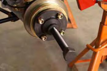 20. Remove the 2 bolts and washers securing the brake caliper to the UHT (Fig. 016).