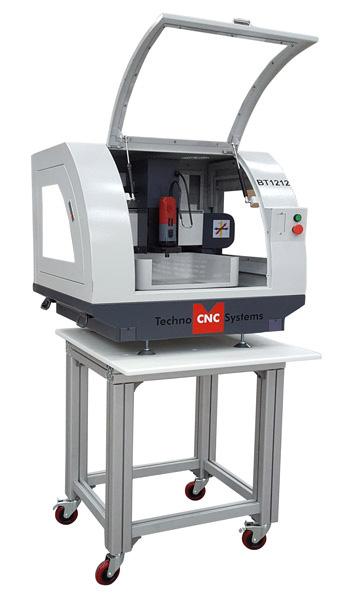 Additional features include ballscrews on all 3 axes, brushless stepper motors (servo optional), heavy duty phenolic vacuum table with aluminum T-slot channels, and Techno s hand-held controller,