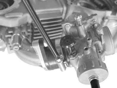 Fix the throttle valve to the carburetor by aligning a notch on the throttle valve with the throttle stop screw.