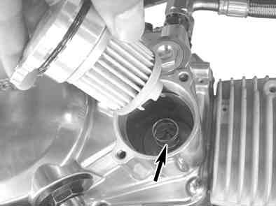 Change of Oil filters: Unfasten two bolts on the oil filter cover, and detach the oil filter cover, oil filter and oil filter spring.