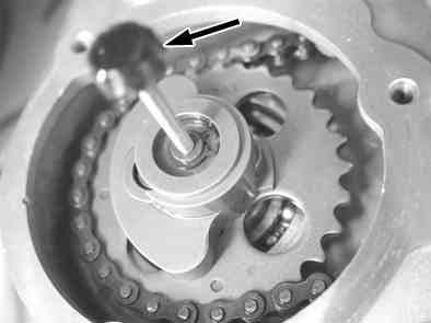 Turn the flywheel and adjust to the top dead Tighten the adjust nut to the specified torque. center(tdc).