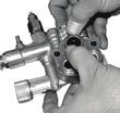 ) Install the valve cap and torque to the proper... Using a reversible pliers, carefully remove the packing retainers (plunger guides). (See. Figure 7 Figure Inspect for any debris or damage.