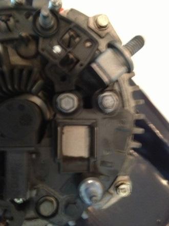 place. Here is the voltage regulator exposed. Remove three 7mm bolts holding it in Here the new regulator.