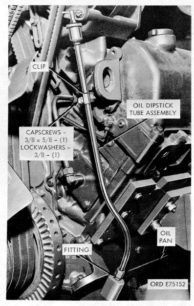 rear end of each cylinder head and remove cross-over with flexible metallic drain return line at tached. (6) Loosen two capscrews, securing fuel pump support bracket (32, fig. B-18), to engine block.
