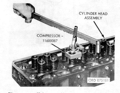 Using valve spring compressor (44, fig. B-28) remove valve assemblies as shown in figure 3-26. c. Using injector sleeve puller (19, fig. B-28) remove injector sleeves as shown in figure 3-27. d.