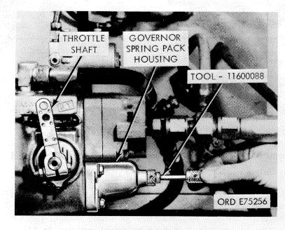 properly seat or that correct spring is installed. (g) If pressure is low add shims below the governor weight assist plunger (fig. 3-92) in the governor weight carrier.