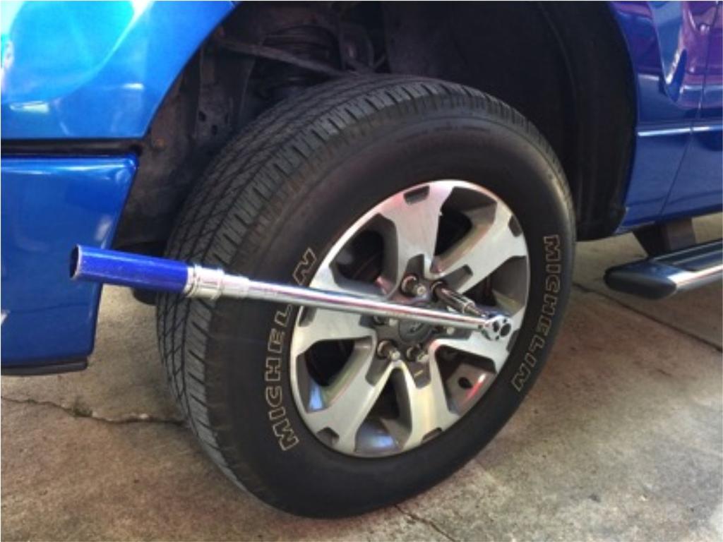 Step1: Start by using either a tire iron, breaker bar, or torque wrench to loosen the lug nuts on the wheels. Be sure not to completely remove them just loosen.
