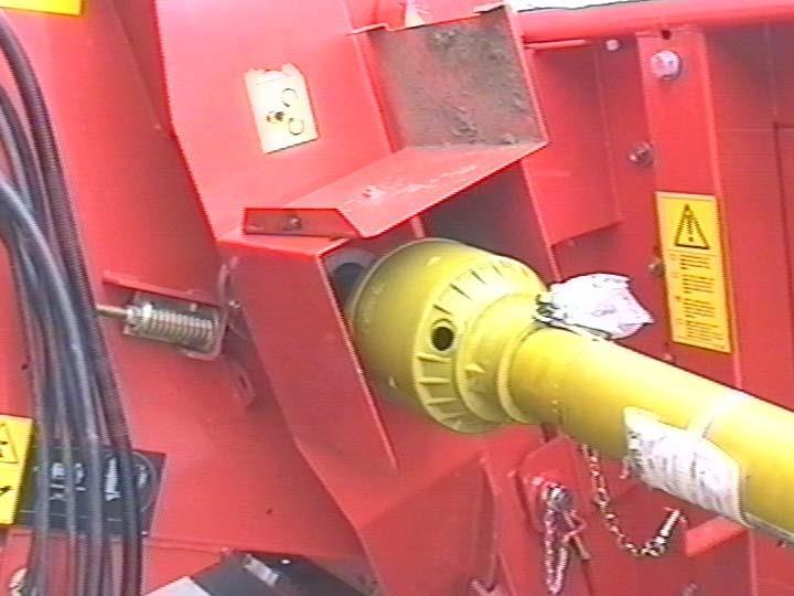 MOUNTING TO THE COMBINE Position the protective shield of the drive shaft, according to the combine