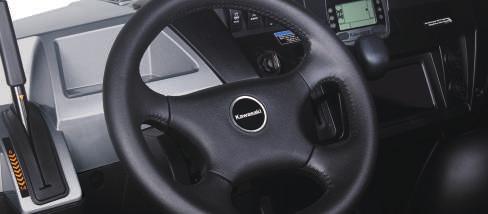 The thickly padded steering wheel features manually adjustable tilt steering with a stepless range