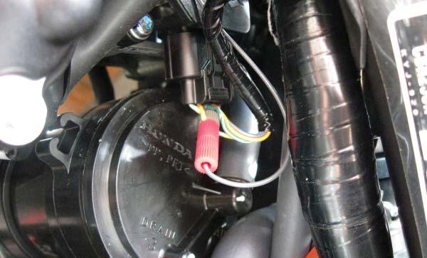 FIG.E 6. Locate the Throttle Position Sensor (TPS) connector.