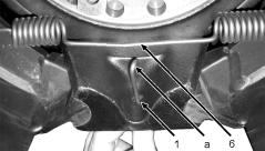 6 Installing the brakes Hook the hook-formed end of the release spring into the hole in the brake shoe with brake spring pliers or a suitable tool.