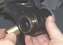 6. Reinstall the steel cup / sleeve from the stock body bushing in the new body bushing. See Photo 3. 7.