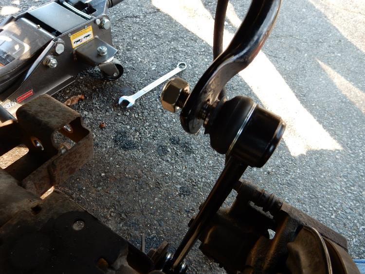 23. Using an 18mm socket and wrench, install provided 1/2 x20 bolt and washer and the 19mm nut and washer to attach the sway bar link to the
