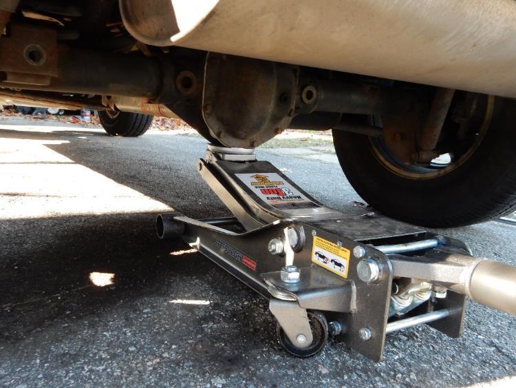6. Using a floor jack, aligned under the rear differential, lift the Jeep high