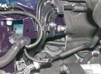Electrical System Wiring harness pass through Protective rubber plug.
