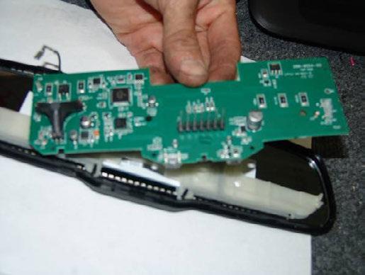 Wrap the mirror circuit board in the supplied foam pieces, and cut an opening for the connector terminals (Figure 23). Figure 23 23.